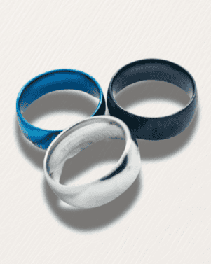 Three metallic rings in blue, silver, and black on a light gray background