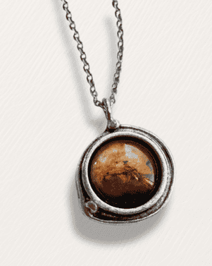 Necklace with a round pendant featuring a brown stone on a white background