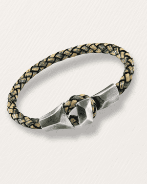 Silver ring with braided band on a light gray background