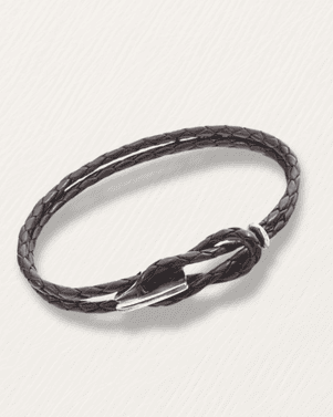 Black braided leather bracelet on a light gray background