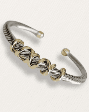 Silver and gold bracelet on a white background