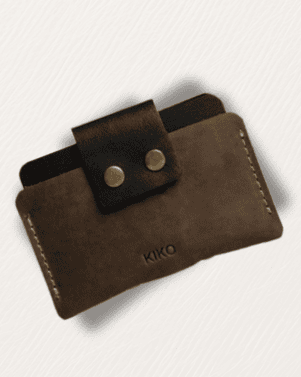 Brown leather wallet with a strap and 'Kiko' branding on a light gray background