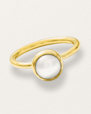 Gold ring with a pearl-like center on a light gray background