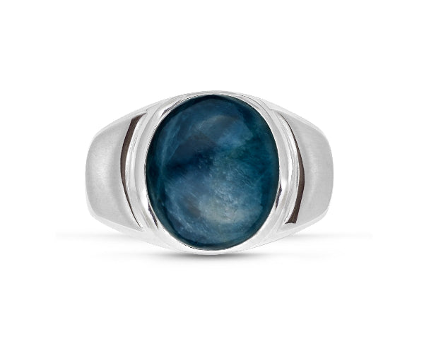 Silver ring with a blue stone on a white background
