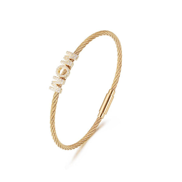 Gold bracelet with diamond accents on a white background