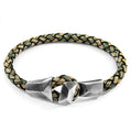 Braided leather bracelet with silver geometric clasp on a white background
