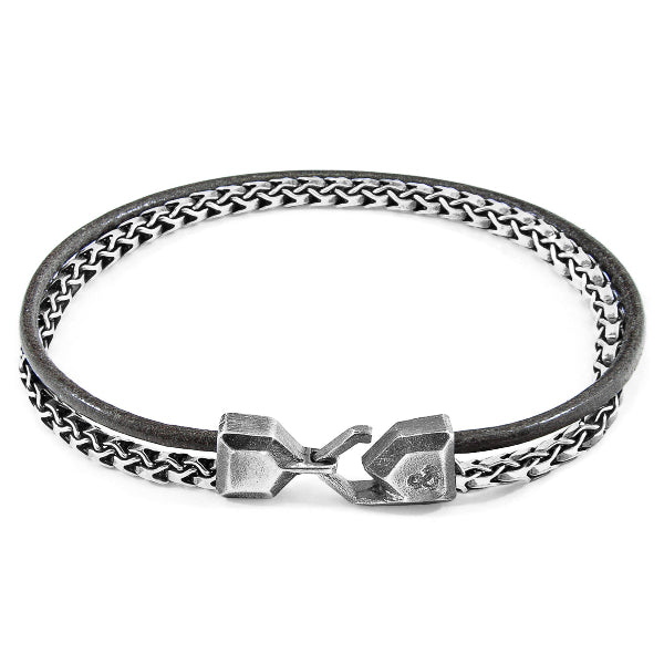 Bracelet with braided design and metal clasp on a white background