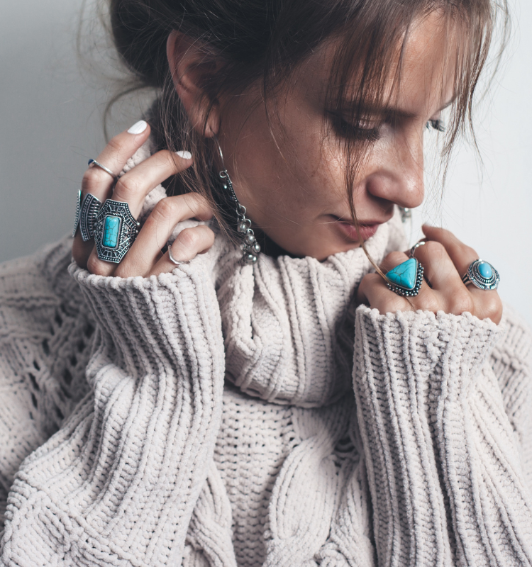 lady in orange dress wearing chic, modern boho chains and gold pendant 
