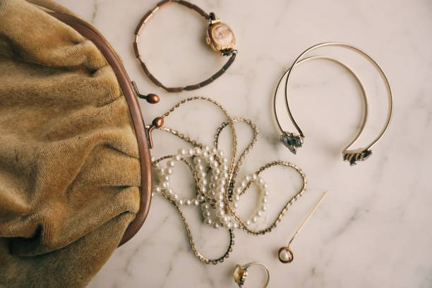mixed elegant jewelry falling out of velvet bag