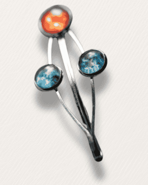 Decorative hair clip with colorful stones on a white background