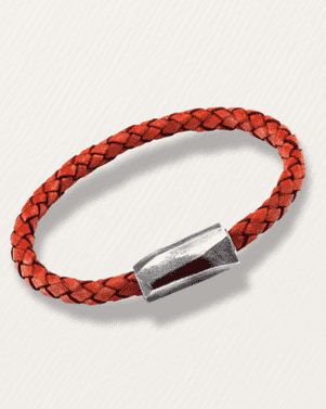 Red braided leather bracelet with a silver clasp on a light gray background