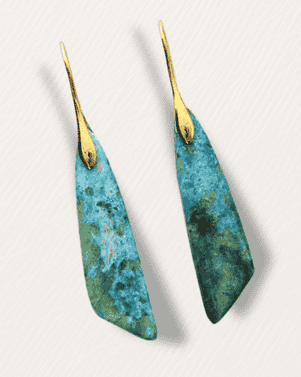 Pair of earrings with blue and green marbled design on a white background