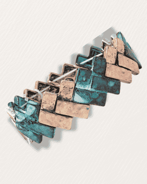Geometric jewelry piece with blue and bronze square stones on a light gray background