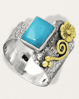 Silver ring with turquoise stone and gold accents on a white background