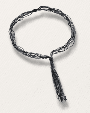 Black braided necklace on a white background