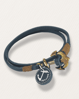 Navy blue leather bracelet with gold anchor charm on a light gray background