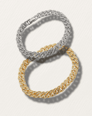 Two interlocking bracelets, one silver and one gold, on a light gray background.