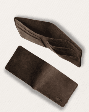 Brown headband and hair tie on a light gray background