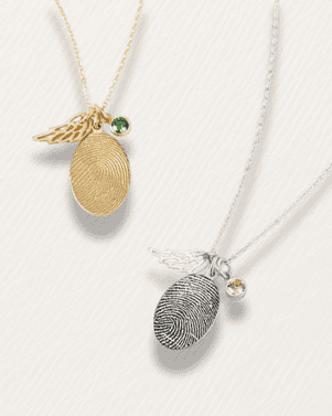 Two necklaces with fingerprint pendants on a white background