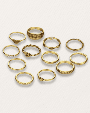 Set of gold rings on a light gray background