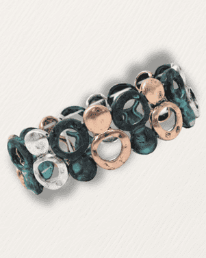 Bracelet with green and rose gold circular beads on a light gray background