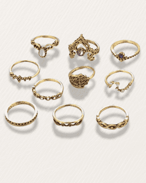 Set of gold rings on a light gray background