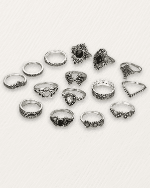Collection of silver rings with various designs on a white background