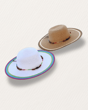 Two sunhats, one white and one brown, on a light beige background