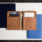 Brown leather wallet with card slots and money compartment on a white background