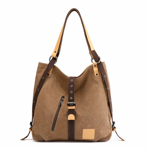 Brown shoulder bag with leather straps on a white background