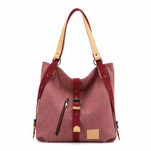 Red handbag with brown straps on a white background