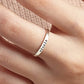 Silver ring with 'nicole' engraved on a finger