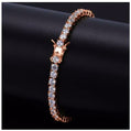 Rose gold bracelet with clear stones on a black background