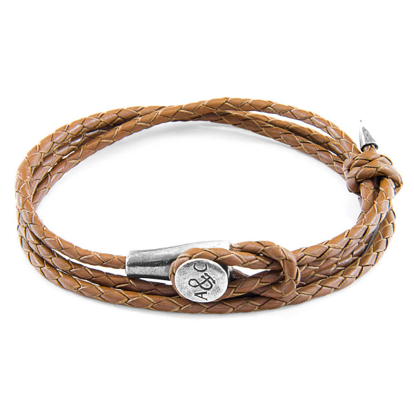 Brown braided leather bracelet with a silver clasp on a white background