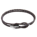 Brown braided leather bracelet with a silver clasp on a white background