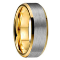 Two-tone gold and silver ring on a white background