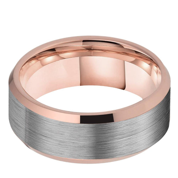 Rose gold and silver ring on a white background
