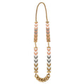 Necklace with chevron patterned beads and gold chain on a white background