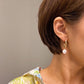 Modern 18k Gold Dangle Pearl Earrings