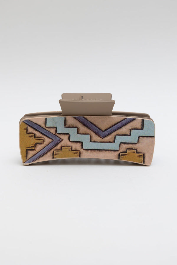 Clutch bag with geometric pattern on a white background