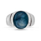 Silver ring with a blue stone on a white background