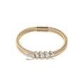 Gold bracelet with diamond accents on a white background