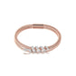 Rose gold bracelet with diamond accents on a white background
