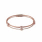 Rose gold bracelet with diamond accents on a white background