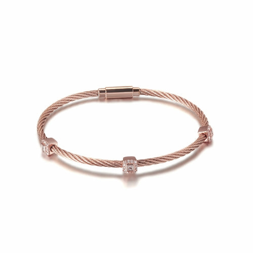 Rose gold bracelet with diamond accents on a white background