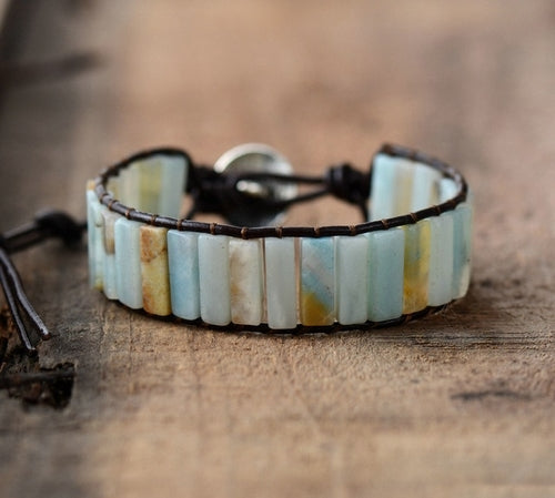 Bracelet with striped pattern on a wooden surface
