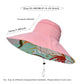 Pink sun hat with colorful brim and measurement details on a white background