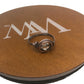Ring on a brown circular stand with a logo