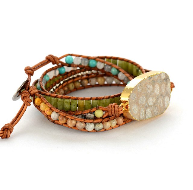 Multicolored beaded bracelet with a large stone clasp on a white background