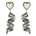 Spiral earrings with heart-shaped gemstones on a white background